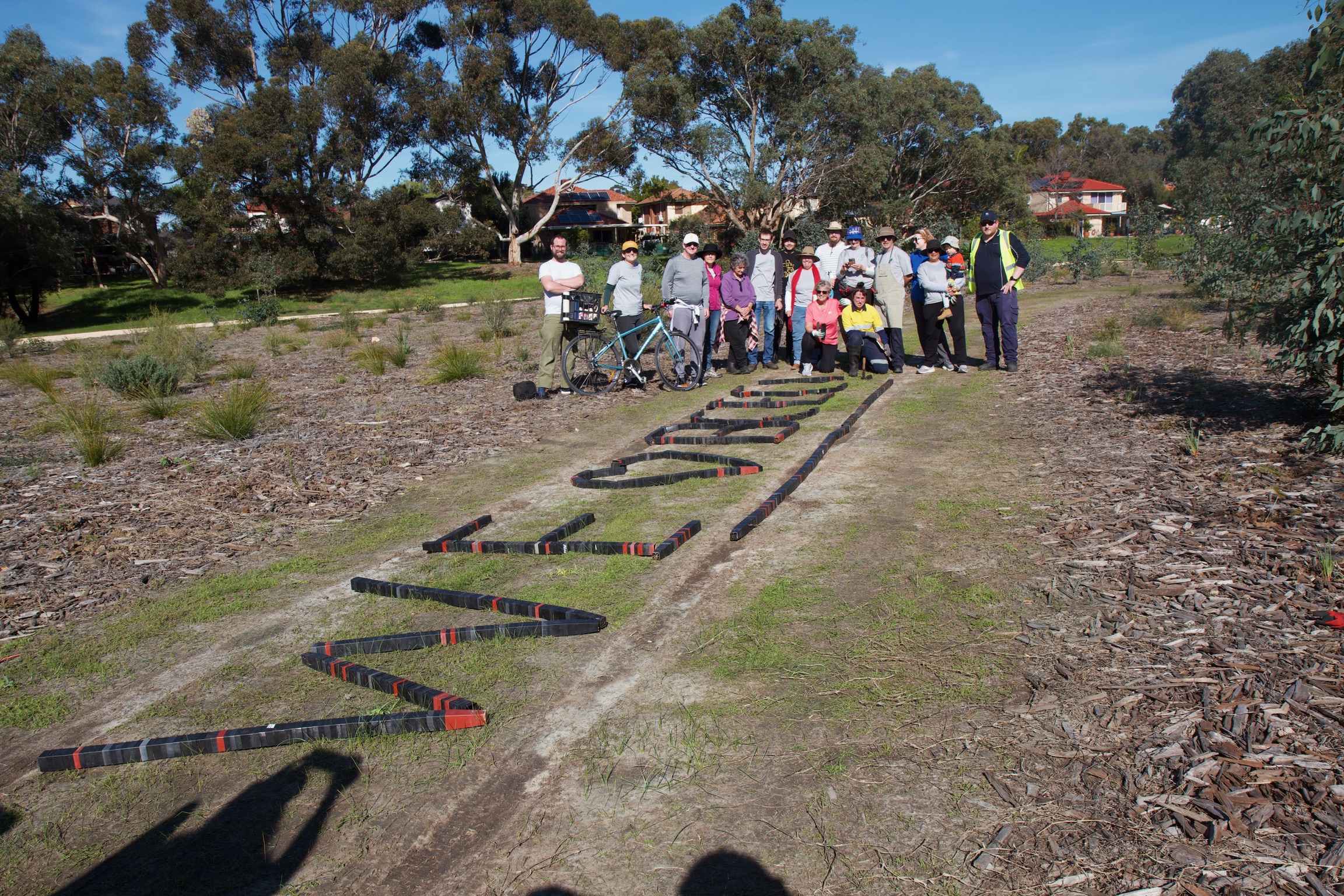 Volunteers and seedlings ready for planting at Garvey Park