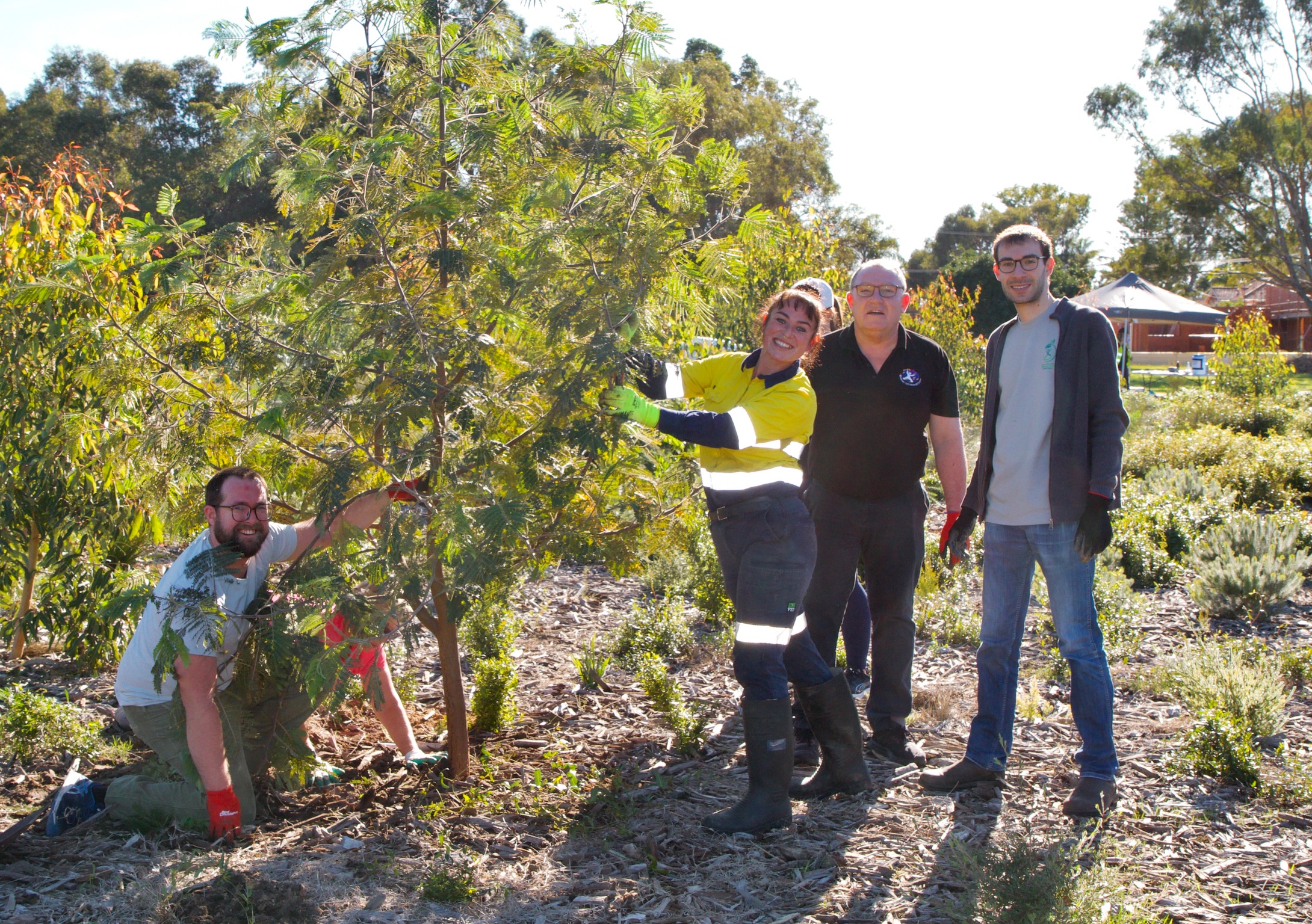 Community members planting along the Garvey Park foreshore